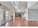 Open living room features soaring ceilings, staircase, and wood flooring at 212 Rontunda Dr, Kissimmee, FL 34758