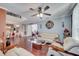 Living area with hardwood floors, sofas, and view into the kitchen at 212 Rontunda Dr, Kissimmee, FL 34758