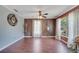 Living room featuring hardwood floors, natural light, neutral paint, and stylish ceiling fan at 212 Rontunda Dr, Kissimmee, FL 34758