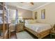 Bright bedroom featuring a light wood platform bed and wood floors at 2136 Laurel Blossom Cir, Ocoee, FL 34761