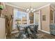 Bright dining area with glass table and view at 2136 Laurel Blossom Cir, Ocoee, FL 34761