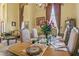 Formal dining room featuring a beautiful table setting and large windows at 2136 Laurel Blossom Cir, Ocoee, FL 34761
