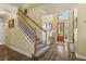 Bright and spacious entryway with hardwood floors and staircase at 2136 Laurel Blossom Cir, Ocoee, FL 34761