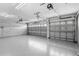 Spacious two-car garage with automatic door opener and ample storage space at 2136 Laurel Blossom Cir, Ocoee, FL 34761