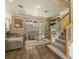 Spacious living room with hardwood floors, large windows, and comfortable seating at 2136 Laurel Blossom Cir, Ocoee, FL 34761