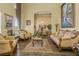 Formal living room with ornate furniture and hardwood floors at 2136 Laurel Blossom Cir, Ocoee, FL 34761