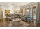Spacious living room with sectional sofa and access to kitchen at 2136 Laurel Blossom Cir, Ocoee, FL 34761