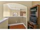 Home office with built-in shelving and hardwood floors at 2136 Laurel Blossom Cir, Ocoee, FL 34761