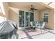 Relaxing patio with seating area and grill, ideal for outdoor dining at 2136 Laurel Blossom Cir, Ocoee, FL 34761