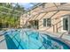 Inviting screened pool area with spacious patio, perfect for outdoor entertaining at 2136 Laurel Blossom Cir, Ocoee, FL 34761
