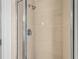 Clean shower with beige tiles and glass enclosure at 2136 Laurel Blossom Cir, Ocoee, FL 34761