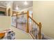 Upstairs hall with wood railing and bedroom view at 2136 Laurel Blossom Cir, Ocoee, FL 34761