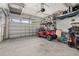 Spacious garage with golf cart, storage, and overhead storage at 2156 Antilles Club Dr, Kissimmee, FL 34747