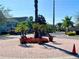 Attractive community entrance with landscaping and gated access at 2200 San Christabolo Dr # 106, Kissimmee, FL 34741