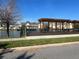 Relaxing lakefront deck with pergola and seating at 2200 San Christabolo Dr # 106, Kissimmee, FL 34741