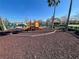playground with colorful equipment and safety surface at 2200 San Christabolo Dr # 106, Kissimmee, FL 34741