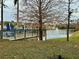 Community pond with a fountain and walking path at 2200 San Christabolo Dr # 106, Kissimmee, FL 34741