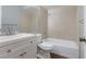 Clean bathroom with a bathtub, toilet, and white vanity at 2223 Silver Pines Pl # 501, Orlando, FL 32808