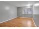 Well-lit bedroom showcasing wood floors and a window at 2223 Silver Pines Pl # 501, Orlando, FL 32808