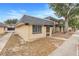 Side view of tan house with gray roof and landscaping at 2223 Silver Pines Pl # 501, Orlando, FL 32808