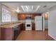 Kitchen boasts wood cabinets and a tile floor at 2223 Silver Pines Pl # 501, Orlando, FL 32808