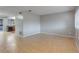 Open living space with tile floor and kitchen view at 2223 Silver Pines Pl # 501, Orlando, FL 32808