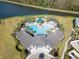 Resort-style pool and community clubhouse with surrounding landscape at 2612 Yountville Ave, Kissimmee, FL 34741
