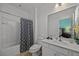 Clean bathroom with a shower/tub combo and white vanity at 2612 Yountville Ave, Kissimmee, FL 34741