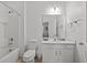 Clean bathroom with white vanity, toilet, and bathtub at 2612 Yountville Ave, Kissimmee, FL 34741