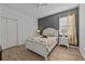 Bright bedroom with a white bed frame and gray walls at 2612 Yountville Ave, Kissimmee, FL 34741