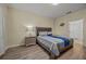 Bedroom with a full bed, nightstand, and adjacent bathroom access at 2612 Yountville Ave, Kissimmee, FL 34741