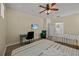 Bedroom with two twin beds, a desk and ceiling fan at 2612 Yountville Ave, Kissimmee, FL 34741