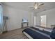 Bedroom with queen bed and mounted TV. Offers ample floor space at 2612 Yountville Ave, Kissimmee, FL 34741
