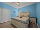 Bedroom with a king-size bed and double doors at 2612 Yountville Ave, Kissimmee, FL 34741