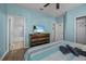 Bedroom with a dresser, TV, and striped bedding at 2612 Yountville Ave, Kissimmee, FL 34741