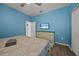 Bedroom with a king bed, dresser, and ensuite bathroom at 2612 Yountville Ave, Kissimmee, FL 34741