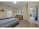 Bedroom with a queen bed and access to the living area at 2612 Yountville Ave, Kissimmee, FL 34741