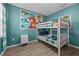 Bunk beds in a bedroom with teal walls and Moana-themed decor at 2612 Yountville Ave, Kissimmee, FL 34741