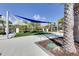 Relaxing community patio with shade sails and artificial turf at 2612 Yountville Ave, Kissimmee, FL 34741