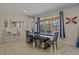 Bright dining room with a large table and six chairs at 2612 Yountville Ave, Kissimmee, FL 34741