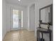 Elegant entryway with a decorative mirror and tiled floors at 2612 Yountville Ave, Kissimmee, FL 34741