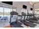 Modern fitness center with treadmills and views of the pool at 2612 Yountville Ave, Kissimmee, FL 34741