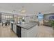 Open concept kitchen with large island, looking toward living room at 2612 Yountville Ave, Kissimmee, FL 34741