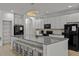Modern kitchen with granite countertops and large island at 2612 Yountville Ave, Kissimmee, FL 34741