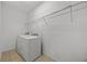 Laundry room with washer, dryer, and shelving at 2612 Yountville Ave, Kissimmee, FL 34741