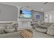 Spacious living room with a fireplace and comfortable seating at 2612 Yountville Ave, Kissimmee, FL 34741