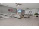 Spacious living room with fireplace and hardwood floors. Features comfortable seating and large TV at 2612 Yountville Ave, Kissimmee, FL 34741