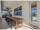 Long wooden table with seating for outdoor dining and entertaining at 2612 Yountville Ave, Kissimmee, FL 34741