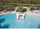 Large resort-style pool with a central water feature at 2612 Yountville Ave, Kissimmee, FL 34741