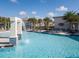 Community pool with waterfall feature and lounge chairs at 2612 Yountville Ave, Kissimmee, FL 34741